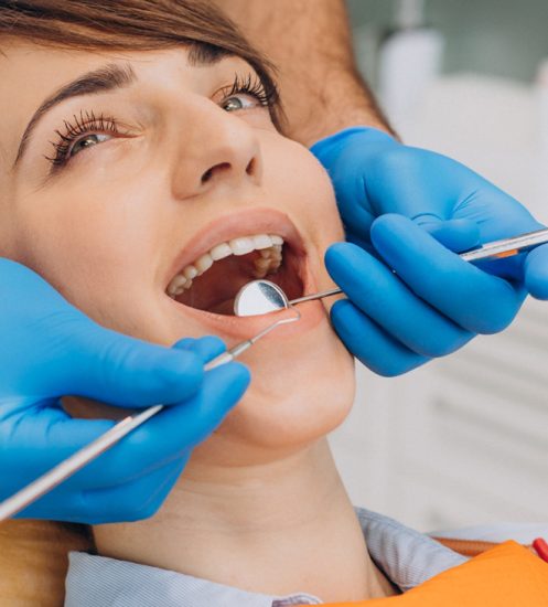 female-patient-sitting-dentist-chair-making-professinal-hygiene